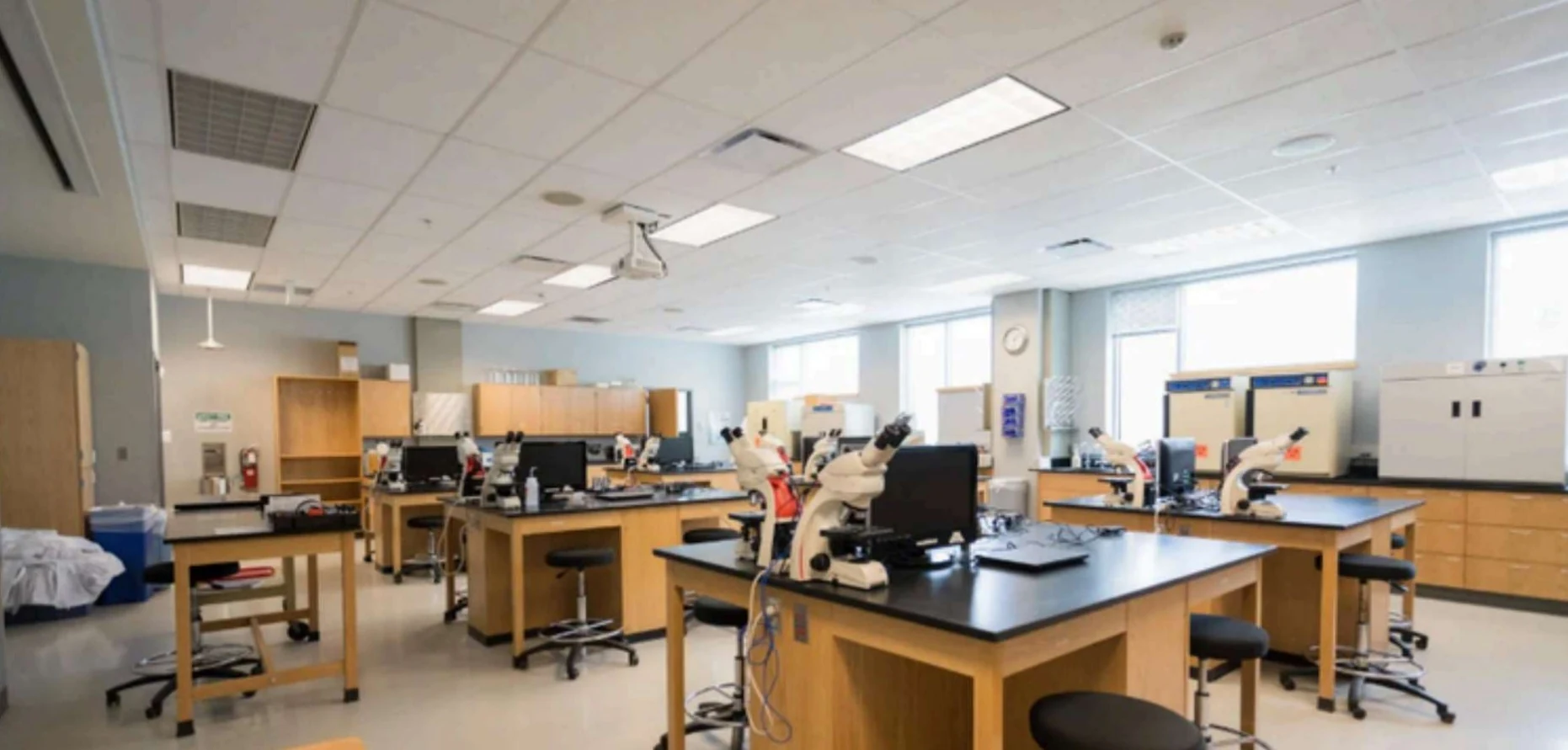 Technical teaching laboratory with lab benches and microscopes